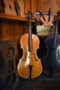 Cellos standing in luthier workshop Royalty Free Stock Photo