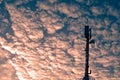 Cellphone base station against dramatic sky. Royalty Free Stock Photo