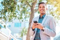 Cellphone, city and happy business man scroll, walking and smile for company social media, website search and contact Royalty Free Stock Photo