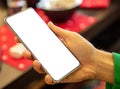 Cellphone empty display on a male hand. Man hold mobile phone with blank screen, close up Royalty Free Stock Photo