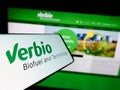 Cellphone with logo of biofuel company Verbio Vereinigte Bioenergie AG on screen in front of website. Royalty Free Stock Photo