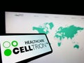 Cellphone with logo of biopharmaceutical company Celltrion Inc. on screen in front of business website.