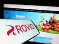 Cellphone with logo of Finnish games company Rovio Entertainment Oyj on screen in front of website. Royalty Free Stock Photo