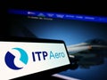 Cellphone with logo of Industria de Turbo Propulsores S.A. (ITP Aero) on screen in front of website.