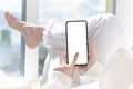 Cellphone mockup. woman user customer hold cellphone mockup with white screen in hand. Use mobile shopping app, check social media Royalty Free Stock Photo