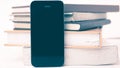 Cellphone with stack of book vintage style Royalty Free Stock Photo