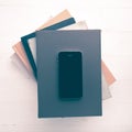 Cellphone with stack of book vintage style Royalty Free Stock Photo