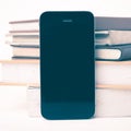 Cellphone with stack of book vintage style Royalty Free Stock Photo