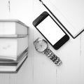 Cellphone with stack of book and watch black and white tone colo Royalty Free Stock Photo