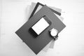 Cellphone with stack of book and watch black and white tone colo Royalty Free Stock Photo
