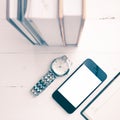 Cellphone with stack of book and watch vintage style Royalty Free Stock Photo