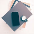 Cellphone with stack of book and watch vintage style Royalty Free Stock Photo
