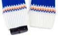 Cellphone sticking out from knitted fabric like sweater or mittens