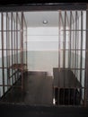 Prison cell with jail iron bars for criminals Royalty Free Stock Photo