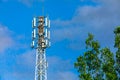 Cellular base station against blue sky. Royalty Free Stock Photo