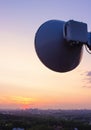 Cellular communications tower on a background of the city and a beautiful sunset in summer Royalty Free Stock Photo