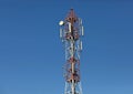 Cellular, mobile phone transmitter tower and weather station Royalty Free Stock Photo