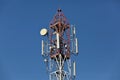 Cellular, mobile phone transmitter tower and weather station Royalty Free Stock Photo