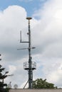 Cellular, mobile phone transmitter tower and weather station Royalty Free Stock Photo