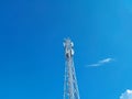 Cellular telephone network tower with blue sky background Royalty Free Stock Photo