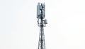 Cellular tower with antennae, equipment against plain white background. This structure enables wireless communication, signal Royalty Free Stock Photo