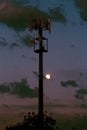 Cellular tower and Sunset. Equipment for relaying cellular and mobile signal. Royalty Free Stock Photo