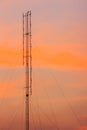Cellular transmitter, folded dipole radio antenna for telecommunications with colorful sky background. Silhouette amateur radio Royalty Free Stock Photo