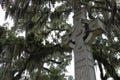 Celtic Christian Stone Cross With Spanish Moss Trees in Cemetery Royalty Free Stock Photo