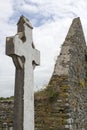 Celtic cross and church ruins Royalty Free Stock Photo