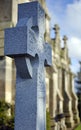 Celtic Cross Headstone in front of a Scottish Chapel Royalty Free Stock Photo