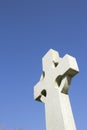 Celtic cross with plain stone face and blue sky Royalty Free Stock Photo