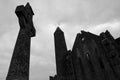 Celtic cross and the ruins of the gothic cathedral. Rock of Cashel. Tipperary county, Ireland Royalty Free Stock Photo