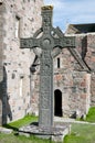 Celtic cross standing near old church Royalty Free Stock Photo