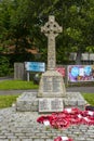 The Celtic Cross styled marble 1st World War memorial in Warsash on the South Coast of England with poppy wreaths