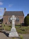 The Celtic Cross War Memorial situated within the Graveyard of Stracathro Parish Church in Angus. Royalty Free Stock Photo