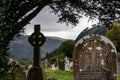 Celtic crosses and tombstones at monastery cemetery of glendalough, ireland Royalty Free Stock Photo