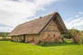 Celtic house with straw thatched roof at Celtic open air museum in Nasavrky, Czech republic