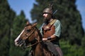 Celtic knight riding horses in traditional costume