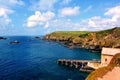 Celtic Sea and an old pier fishermen house in Cornwall, England Royalty Free Stock Photo