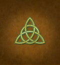 Celtic Trinity Knot or Triquetra against brown background