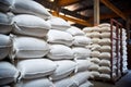 cement bags stacked high in factory warehouse