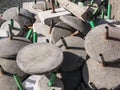 Cement beach sunshade bases dumped in a heap top view