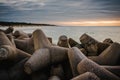 Cement blocks breakwater in the the view of Baltic sea beach. Klaipeda harbour sea gate