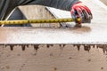 Cement Construction Worker Using Measuring Tape While Forming Pool Coping Royalty Free Stock Photo