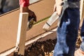 Cement Construction Worker Using Measuring Tape While Forming Pool Coping Royalty Free Stock Photo