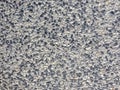 Cement mixed small gravel stone wall or floor abstract texture background.Random pebble gravel oval elements seamless pattern.