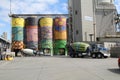 Cement mixer lorry and cement silos.