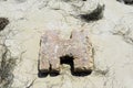 Cement pillar on the beach.