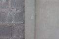 Cement pillar between plastered and unpainted concrete walls in the construction site. Royalty Free Stock Photo