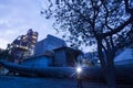 Cement plant factory manufacturing at dusk, sparks of worker with headlamp flashlight during working overtime Royalty Free Stock Photo